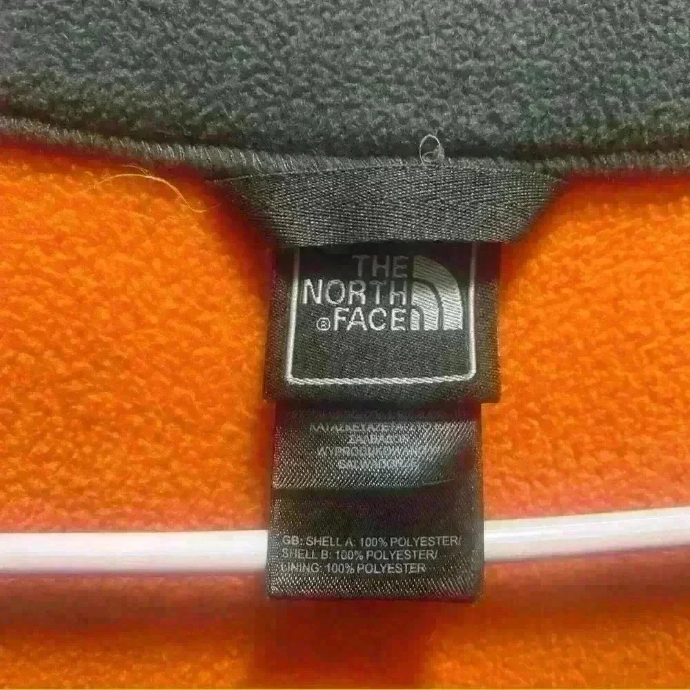 The North Face - orange and gray fleece jacket